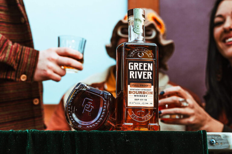 A group of people enjoy Green River’s Kentucky Straight Bourbon Whiskey.