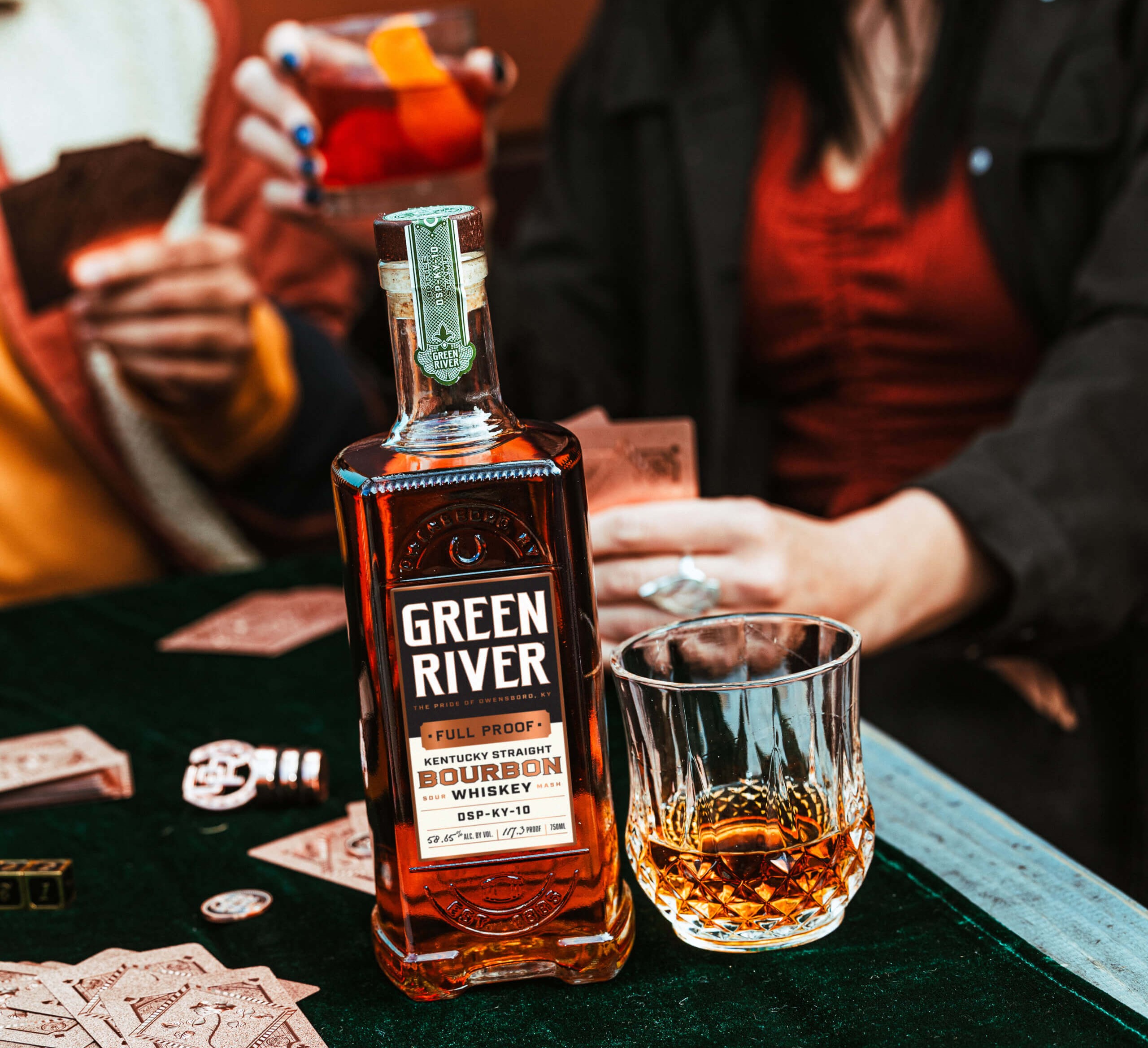 Close-up shot of a bottle and a glass of Kentucky Straight Bourbon Whiskey from Green River.