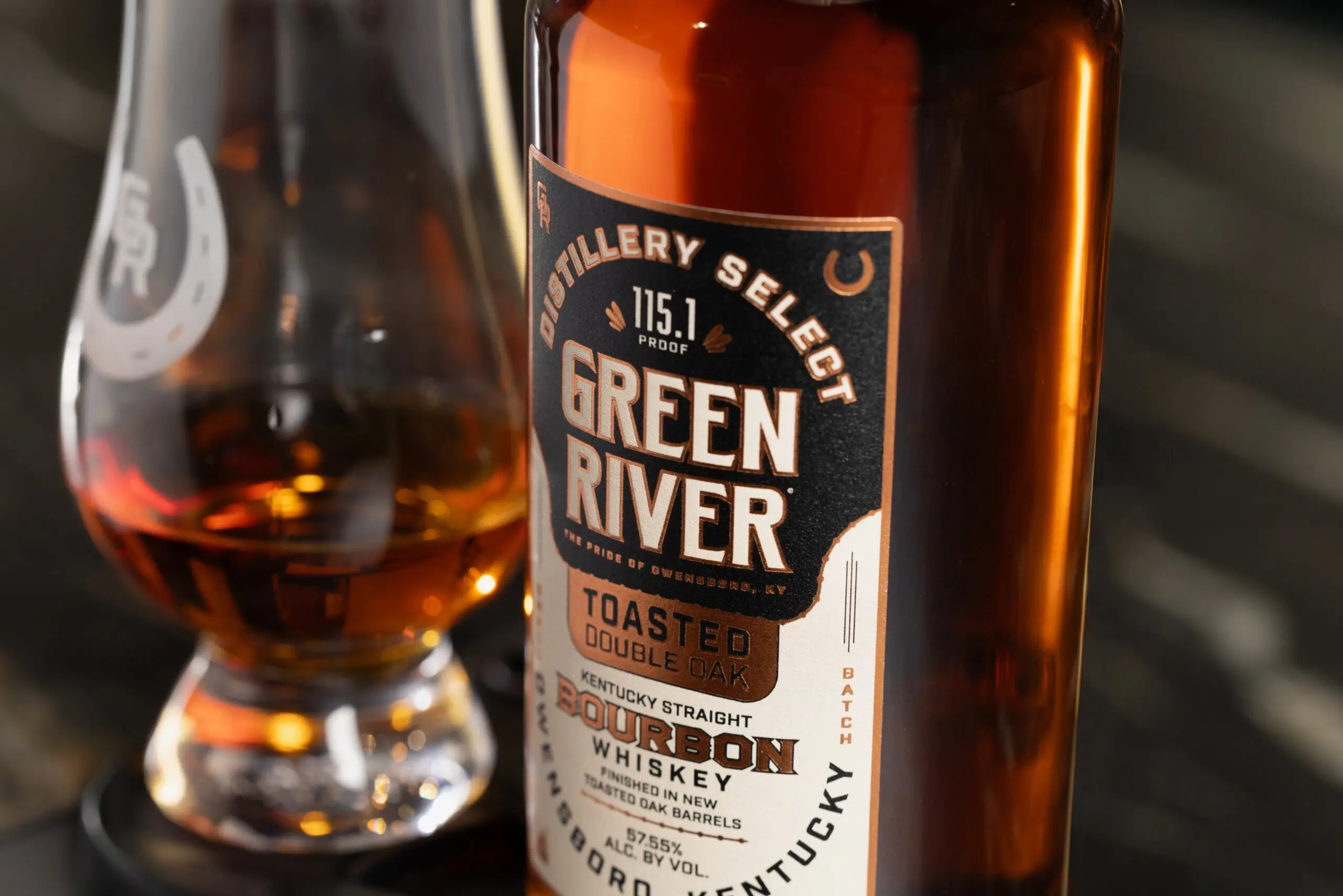 Green River Distillery Select Toasted Double Oak bourbon whiskey bottle with pour in glass.